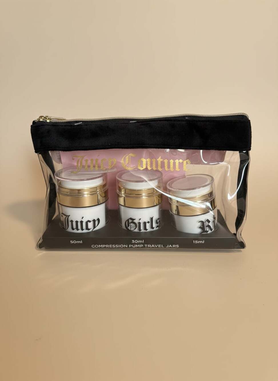 Juicy Couture 3-Piece Compression Pump Travel Jar and Cosmetic Bag Set